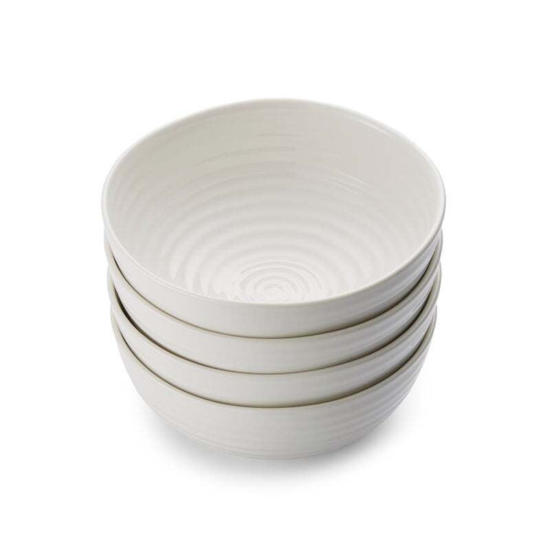 Set of four white Sophie Conran noodle bowls with signature ripple texture stacked together