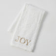 Set of three white cotton Christmas hand towels with champagne-gold embroidered motifs including presents, snow globe, and ‘JOY’ design.
