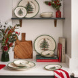 Spode Christmas Tree 12 piece dinner set with festive green rim plates and bowls styled on kitchen bench with red and green festive styled pieces.