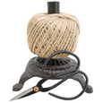 Cast iron string holder with natural jute twine and steel scissors.