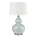 Light blue ceramic table lamp with white shade on white background
