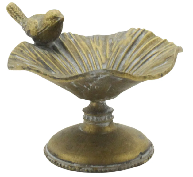 Antique gold trinket dish with bird perched on scalloped dish.