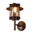 Turner dark brass outdoor wall lantern light with glass shade