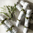eucalyptus crackers styled on table with greenery and natural linens, relaxed coastal entertaining setting