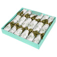 Modern Christmas table décor featuring eucalyptus crackers in sage green palette