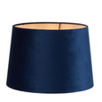 Royal blue velvet drum lamp shade showing soft texture and warm interior lining