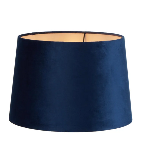 Royal blue velvet drum lamp shade showing soft texture and warm interior lining
