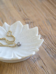 Natural sandstone decorative plate with petal-shaped edges, styled as a jewellery or trinket dish.