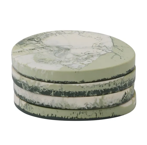 Sage green resin coasters with a soft marbled finish, stacked neatly in a set of four