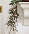 White Berry & Pinecone Swag Large with green foliage, pine needles, pinecones and white berries, styled draped over a mantel.