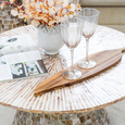 Passionfruit haze wine glass with subtle blush tint and fluted glass design on a styled tabletop
