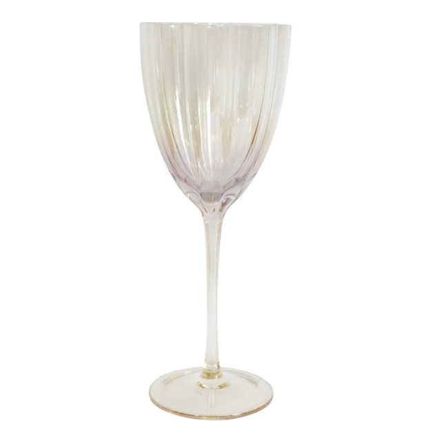 Passionfruit haze wine glass with subtle blush tint and fluted glass design on a styled tabletop