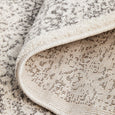 Addison Silver Round Rug folded to show polypropylene pile and backing construction