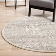 Addison Silver Round Rug styled with grey armchair and round side table