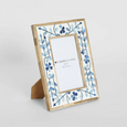 blue floral bone inlay photo frame styled on bedside table in coastal Hamptons bedroom