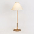 Alpine antique brass table lamp styled on bedside table creating a soft, relaxing glow