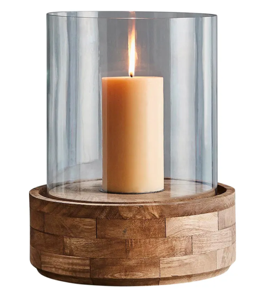 Large Amalfi hurricane lamp with clear glass shade and dark natural wooden base styled on a dining table