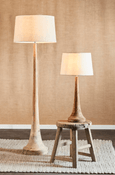 Warm ambient lighting from Large Lancia timber floor lamp with linen shade