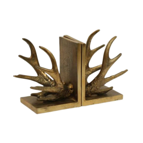 antique gold rustic antler bookends holding books on a shelf