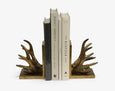 antique gold rustic antler bookends holding books on a shelf