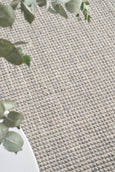 Close-up of Arden Dove rug showing hand-loomed wool and jute pebble texture