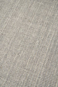 Detailed view of Arden Dove rug weave pattern with soft grey and natural fibres