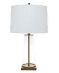 Arlo glass table lamp featuring clear glass body, antique gold detailing and off white linen shade.