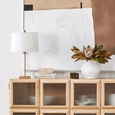 Clear glass Arlo table lamp with antique gold rod and elegant linen shade.