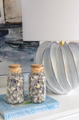 close up of Arya lamp ceramic base showing soft blue glaze and sculptural detail