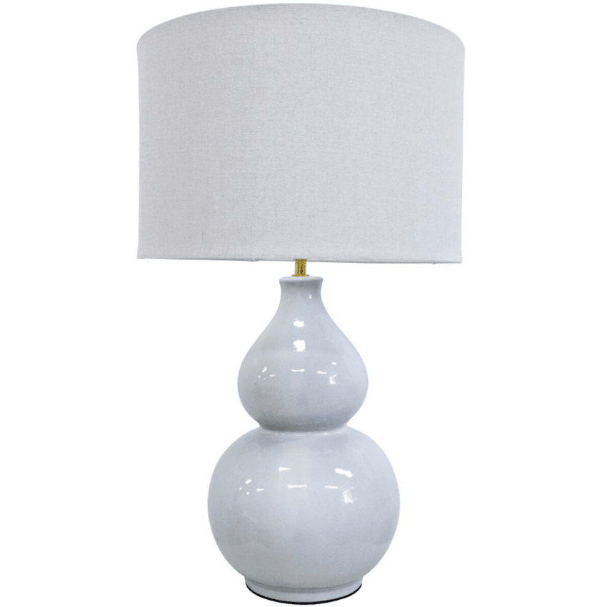 Aura Seafoam ceramic table lamp with linen drum shade styled in a coastal-inspired interior
