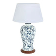 Blue and white ceramic table lamp with bird and floral motif, white shade and timber base