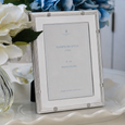 Bali Silver Photo Frame 15cm x 10cm styled with blue and white hydrangeas on a coastal console, featuring a timeless silver-plated design for Hamptons and classic interiors.