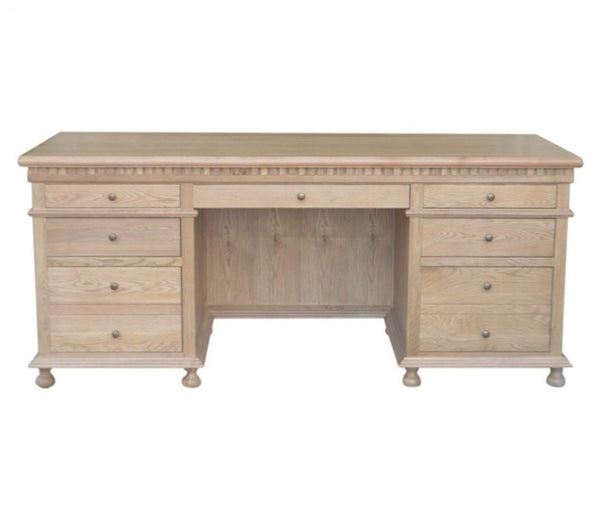 Angled view of the Balmoral Natural Oak Desk showcasing its classic design and storage compartments
