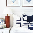 Basic Navy Cushion with White Piping styled on a Hamptons-inspired bed with layered navy and white cushions and coastal décor accents