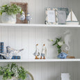 Beach Birds Set of 2 displayed on white Hamptons-style shelving with blue and white ceramics, greenery, coastal ornaments and decorative photo frames.