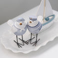 Beach Birds Set of 2 styled on a white ceramic tray with a decorative sailing boat in a coastal home.