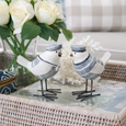 Beach Birds Set of 2 styled on a whitewashed rattan tray with white roses, coral and coastal décor in a Hamptons living room.