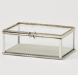 Silver rectangular glass jewellery box with decorative bow detail and clear display panels