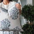 Bellamy Garden Cushion Coastal Blue 50cm showing the blue botanical print, white cotton fabric and coordinating blue piped edge.