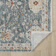 Bellamy Sea Glass Rug corner turned back to show its cross-woven cotton base and finished edge.