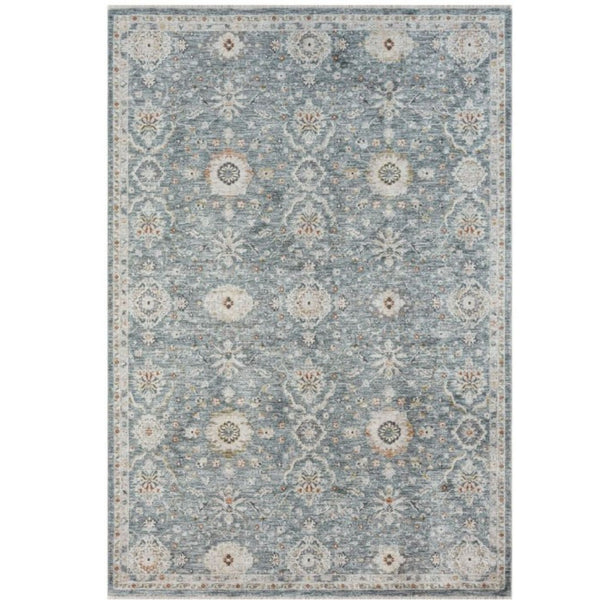 Bellamy Sea Glass Rug with muted blue-green ground, ivory floral motifs and warm vintage-inspired accents.