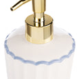 White ceramic soap dispenser with scalloped blue trim and gold-tone pump from the Bellamy Collection, ideal for Hamptons-style bathrooms. Close up of scalloped top of dispenser.