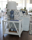 Close-up of the Benedict White Side Table highlighting the tempered glass top and painted timber finish.
