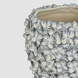 close up of hand-applied floral detailing on blue and white bloom vase