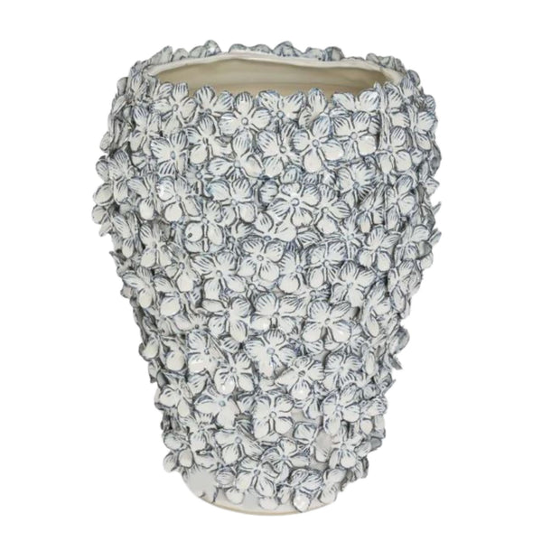 tall blue and white stoneware vase with hand-applied floral texture detail