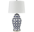 Blue and white ceramic table lamp with white shade styled in a Hamptons-inspired interior
