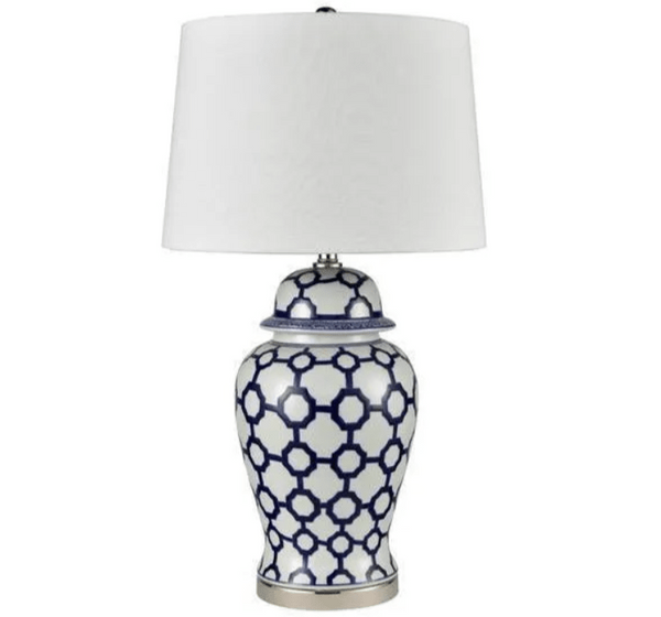 Blue and white ceramic table lamp with white shade styled in a Hamptons-inspired interior
