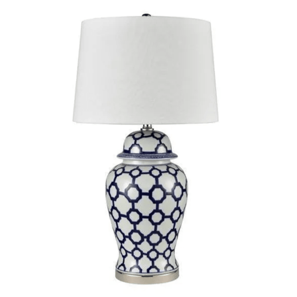 Blue and white ceramic table lamp with white shade styled in a Hamptons-inspired interior
