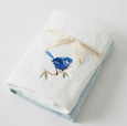 Blue wren hand towel set styled in a soft coastal bathroom setting with folded cotton towels