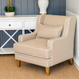 Bondi Hamptons Armchair in natural upholstery styled against a blue panelled wall with white Hamptons console table.